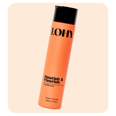 lohy nourish & flourish conditioner and mask 300ml bottle angled on a pastel orange background