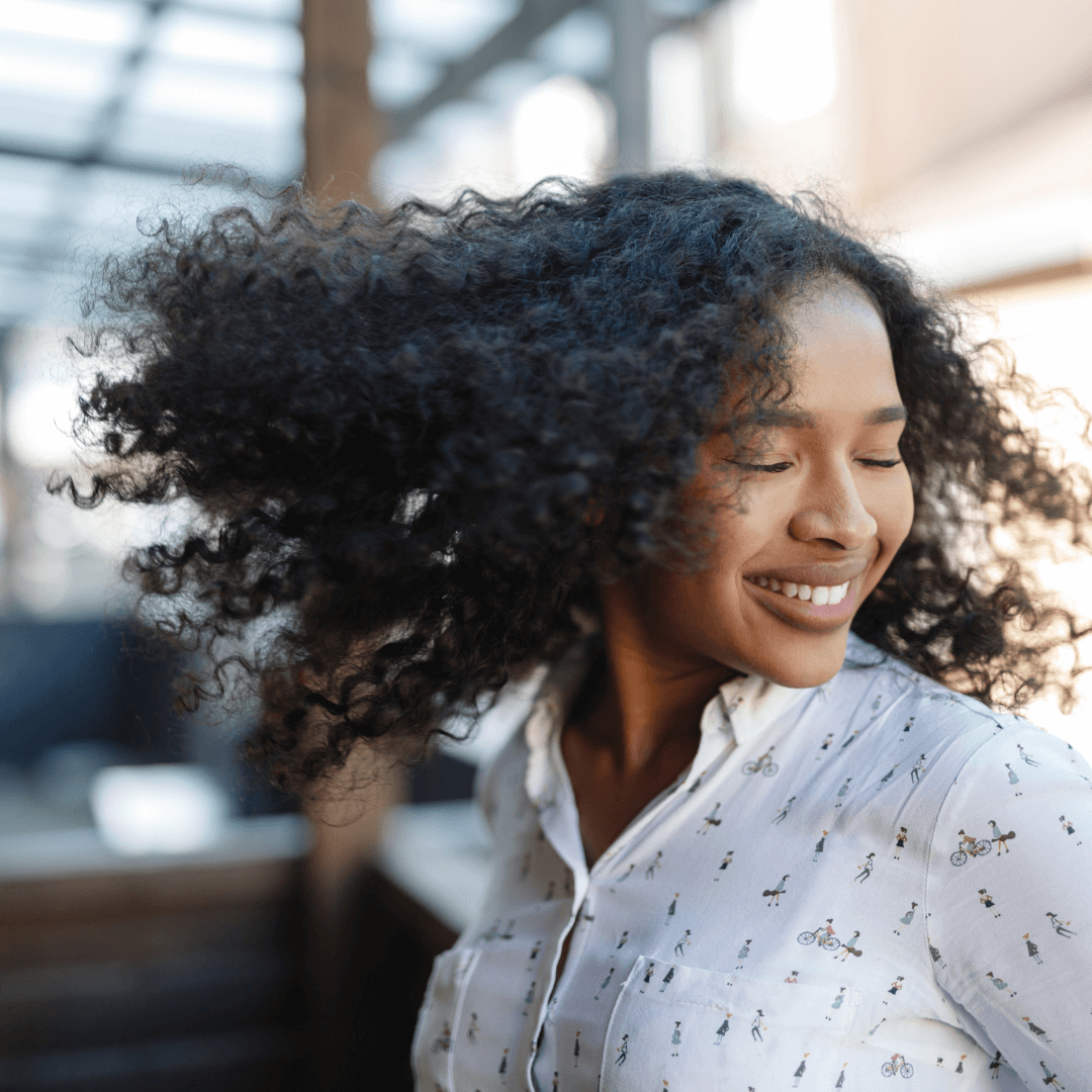woman happy, curly black hair